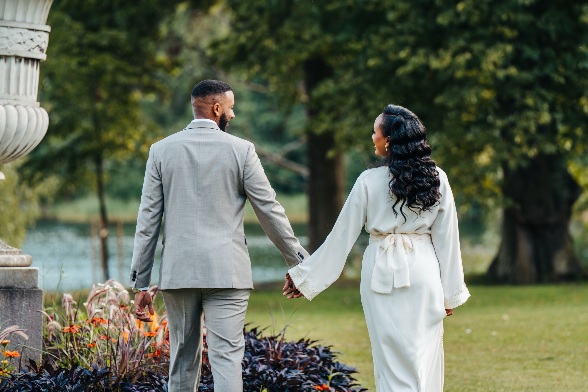 Couple walking through autumn garden